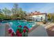 Relaxing community pool and clubhouse featuring beautiful landscaping and plenty of seating at 1325 Telfair Way, Charleston, SC 29412