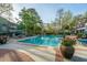 Refreshing community pool features well-maintained landscaping, lounge seating, and clubhouse at 1325 Telfair Way, Charleston, SC 29412