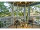 Relaxing screened porch with outdoor seating overlooking lush greenery at 1325 Telfair Way, Charleston, SC 29412