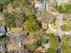 A high-angle shot showcases homes tucked among established trees, providing a sense of seclusion and community at 1515 Devons St, Charleston, SC 29412