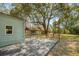 Spacious backyard with a deck, shed, string lights, and mature trees at 1515 Devons St, Charleston, SC 29412