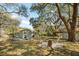 Spacious backyard with multiple outbuildings and a fire pit area, perfect for relaxing and entertaining at 1515 Devons St, Charleston, SC 29412