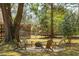 Backyard featuring a fire pit with seating surrounded by a circle of gravel at 1515 Devons St, Charleston, SC 29412