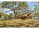 Spacious backyard with multiple outbuildings and a fire pit area, perfect for relaxing and entertaining at 1515 Devons St, Charleston, SC 29412