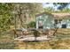 Inviting backyard with a cozy fire pit area surrounded by Adirondack chairs, perfect for outdoor gatherings at 1515 Devons St, Charleston, SC 29412