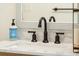 Close up view of a bathroom vanity with decorative faucet and a white countertop at 1515 Devons St, Charleston, SC 29412
