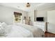 Bright bedroom with white dressers, neutral walls, and a cozy woven light fixture at 1515 Devons St, Charleston, SC 29412