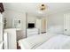 Bright bedroom featuring neutral walls, white dressers, and wood flooring at 1515 Devons St, Charleston, SC 29412