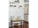 Entryway with bench seating, decorative shelves, and a glimpse into the adjacent kitchen at 1515 Devons St, Charleston, SC 29412