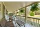 Covered front porch furnished with comfortable seating, perfect for relaxing and enjoying the view at 1515 Devons St, Charleston, SC 29412
