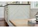 The kitchen island features a herringbone pattern on the base and a dark countertop, adding visual interest at 1515 Devons St, Charleston, SC 29412