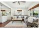 Cozy living room with a large sectional sofa, accent rug, and view into the kitchen at 1515 Devons St, Charleston, SC 29412