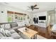 The living room showcases a large gray couch, wood floors, and neutral decor, creating a cozy atmosphere at 1515 Devons St, Charleston, SC 29412