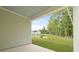 Scenic backyard patio overlooking pond and green landscape at 182 E Pinckney St, Lincolnville, SC 29485