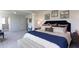 This main bedroom has a padded headboard, a dresser, and neutral decor at 182 E Pinckney St, Lincolnville, SC 29485