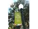 Community sign that reads: At The Heart of it All. Community offers convenient amenities and a great location at 182 E Pinckney St, Lincolnville, SC 29485