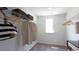 This is a bright walk-in closet with plenty of racks and room for storage at 182 E Pinckney St, Lincolnville, SC 29485