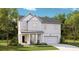 Charming two-story home with white siding, a welcoming front porch, attached garage, and well-manicured lawn at 1827 Nola Run, Summerville, SC 29485