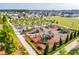 Aerial view of a community playground with modern equipment, landscaping, and nearby homes at 1827 Nola Run, Summerville, SC 29485