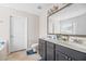 Well-lit bathroom featuring double sinks, a large mirror, and neutral decor at 184 Charlesfort Way, Moncks Corner, SC 29461