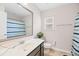 A well-lit bathroom featuring a vanity with modern fixtures, a toilet, and a shower-tub combination at 184 Charlesfort Way, Moncks Corner, SC 29461