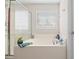 Clean bathroom featuring a large tub with glass shower and tiled walls at 184 Charlesfort Way, Moncks Corner, SC 29461