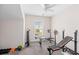 Bedroom with a window overlooking a suburban neighborhood and a full weight set at 184 Charlesfort Way, Moncks Corner, SC 29461