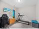 Bright exercise room with treadmill, TV, and desk; perfect for a home gym setup at 184 Charlesfort Way, Moncks Corner, SC 29461