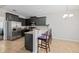Modern kitchen featuring stainless steel appliances, granite countertops, and barstool seating at 184 Charlesfort Way, Moncks Corner, SC 29461