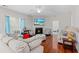 Spacious living room featuring hardwood floors, a fireplace, and comfortable seating at 184 Charlesfort Way, Moncks Corner, SC 29461