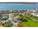 Scenic aerial showcases houses and street with trees near waterfront at 184 Tradd St, Charleston, SC 29401
