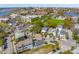 Aerial view of neighborhood with mixed-style homes, mature trees, and nearby waterfront and cityscape at 184 Tradd St, Charleston, SC 29401