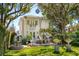 Beautiful backyard featuring a seating area on a stone patio, a fountain and beautiful landscaping at 184 Tradd St, Charleston, SC 29401