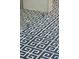 Close up of bathroom floor with a modern geometric tile in the remodeled bathroom at 184 Tradd St, Charleston, SC 29401