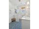 Modern bathroom featuring a glass-enclosed shower, geometric tile flooring, and modern fixtures at 184 Tradd St, Charleston, SC 29401