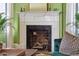 Living room fireplace with marble surround and decorative mantel at 184 Tradd St, Charleston, SC 29401