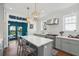 A lovely kitchen featuring white subway tile, a center island with seating, and stainless steel appliances at 184 Tradd St, Charleston, SC 29401