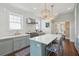 A lovely kitchen featuring white subway tile, a center island with seating, and stainless steel appliances at 184 Tradd St, Charleston, SC 29401