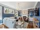 Elegant living room with built-in bookshelves, fireplace, and a large window at 184 Tradd St, Charleston, SC 29401
