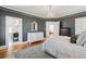 Bedroom featuring a chandelier, hardwood floors, and neutral tones at 184 Tradd St, Charleston, SC 29401