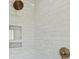 Close-up of the shower with sleek gray tile and modern fixtures in the renovated primary bathroom at 184 Tradd St, Charleston, SC 29401