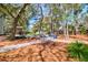Serene backyard space featuring a cozy fire pit area with chairs and a dining area for outdoor gatherings at 2107 Nicholas David Path, Johns Island, SC 29455