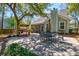 Inviting backyard featuring a dining area and grilling station perfect for outdoor entertaining and relaxation at 2107 Nicholas David Path, Johns Island, SC 29455