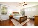 Bedroom with a ceiling fan, natural light, and a bed with decorative pillows at 2107 Nicholas David Path, Johns Island, SC 29455