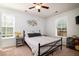 Cozy bedroom with a metal frame bed and natural light from two windows at 2107 Nicholas David Path, Johns Island, SC 29455