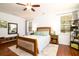 Bright bedroom with a ceiling fan, hardwood floors, natural light and comfortable decor at 2107 Nicholas David Path, Johns Island, SC 29455