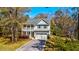 Charming two-story home featuring a welcoming front porch, a well-maintained lawn, and a private driveway at 2107 Nicholas David Path, Johns Island, SC 29455