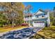 Attractive two-story home with a charming porch, well-kept lawn, and a private driveway, ideal for suburban living at 2107 Nicholas David Path, Johns Island, SC 29455