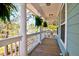 Inviting front porch with classic columns and well-maintained railings at 2107 Nicholas David Path, Johns Island, SC 29455