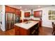 Kitchen island with stainless appliances, granite countertops and wood cabinetry at 2107 Nicholas David Path, Johns Island, SC 29455